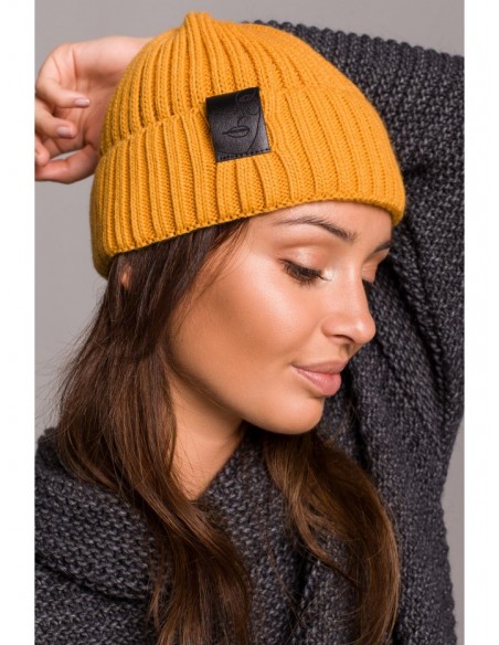 BK059 Ribbed knit beanie with a faux leather badge - yellow