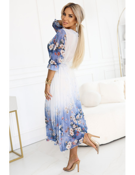 605-1 Moteriška erdvi midi suknelė su voko formos iškirpte ir klostėmis šviesiai mėlyna su lauko gėlėmis   605-1 Moteriška erdvi midi suknelė su voko formos iškirpte ir klostėmis šviesiai mėlyna su lauko gėlėmis